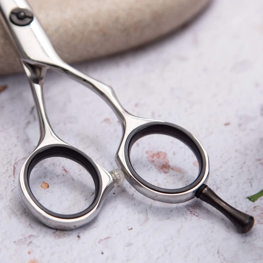 Tijera de peluqueria Zircon 5" con filo navaja 3 Claveles