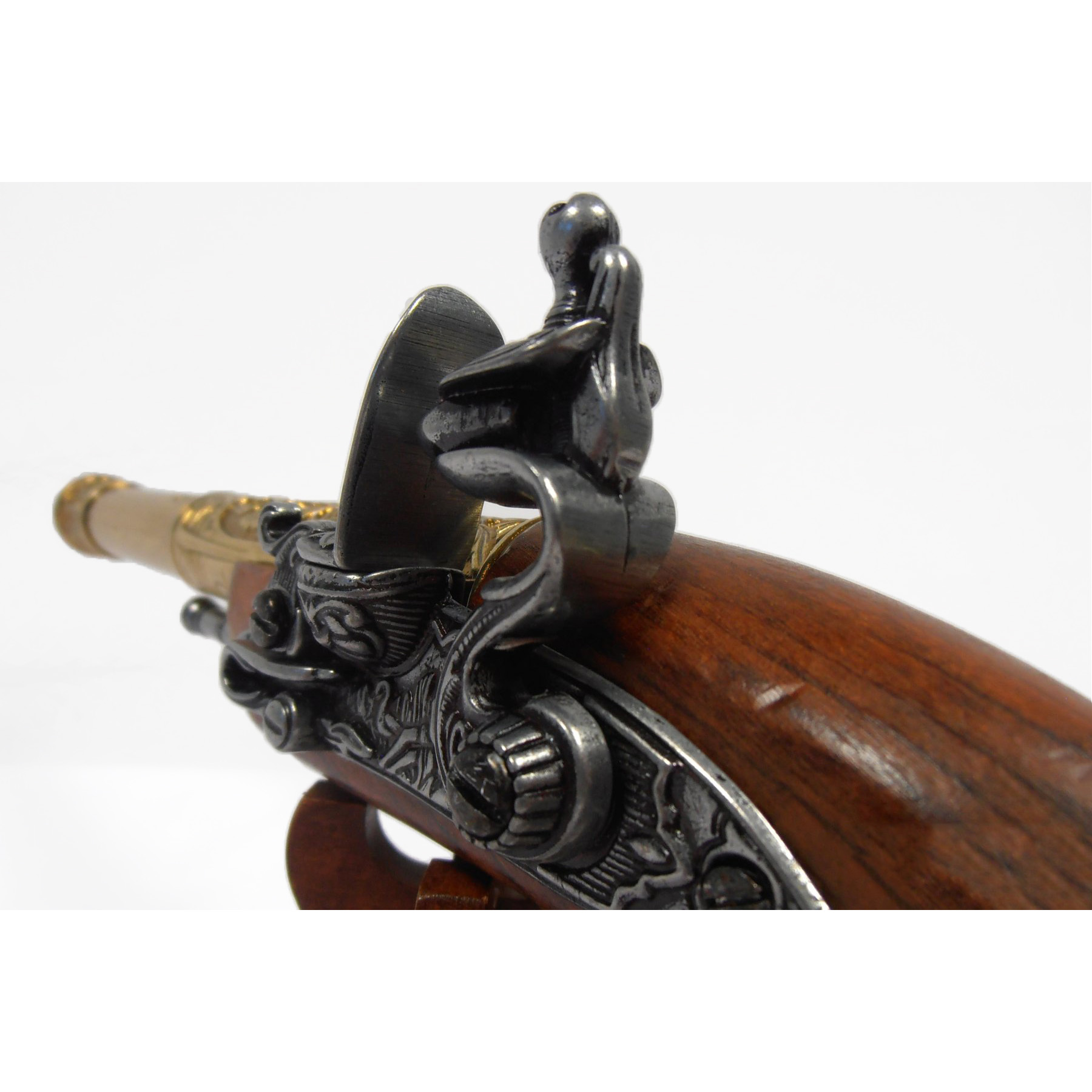 Pistolet à silex gaucher en bois et métal finition laiton, Inde, XVIIIe siècle