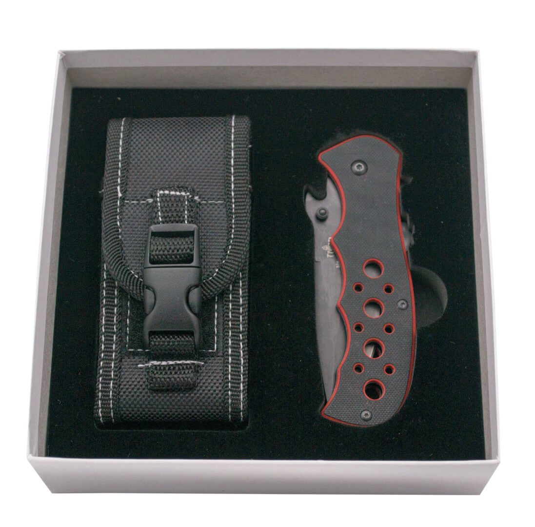 Navaja con apertura asistida y mango de G10 bicolor rojo y negro con sierra